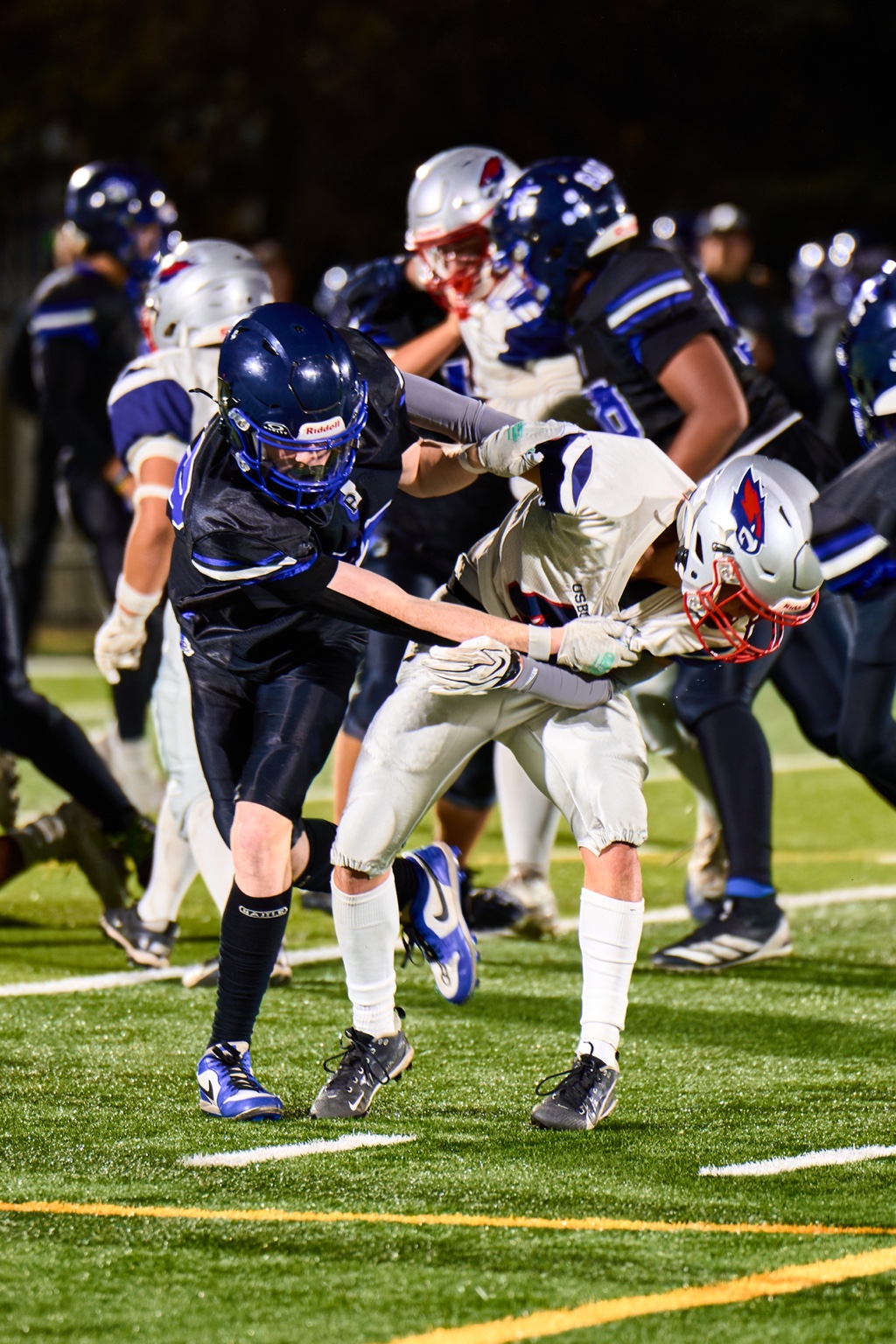 Bandits football players during a tackle